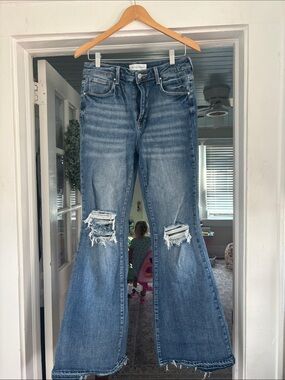 Distressed Medium Blue Flare Jeans with Knee Rips